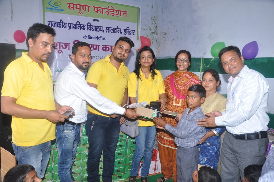 SHOES DISTRIBUTED TO THE STUDENTS OF PRIMARY SCHOOL OF LALDHANG